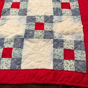 Handcrafted Patchwork Quilt with Red and Blue Patterns